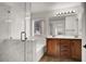 This bathroom features a double sink vanity, shower, and soaking tub at 7814 Granite City Ct, Las Vegas, NV 89166