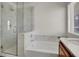 Bright bathroom featuring a shower, bathtub, and vanity with sink at 7814 Granite City Ct, Las Vegas, NV 89166
