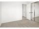 Bedroom with carpet, mirrored closet doors, and an open doorway at 7814 Granite City Ct, Las Vegas, NV 89166