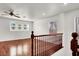 Bonus room featuring hardwood flooring, a ceiling fan, and multiple windows at 7814 Granite City Ct, Las Vegas, NV 89166