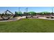 Well-maintained community park with green lawn, climbing structure and covered picnic areas at 7814 Granite City Ct, Las Vegas, NV 89166