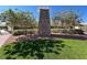 Inviting Providence community sign nestled among mature trees and lush, green landscaping at 7814 Granite City Ct, Las Vegas, NV 89166