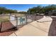 Fenced dog park area for small dogs with walking path and mature trees, ideal for pet owners at 7814 Granite City Ct, Las Vegas, NV 89166