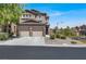 Charming two-story home with a spacious driveway and well-maintained desert landscaping at 7814 Granite City Ct, Las Vegas, NV 89166