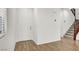 Clean and bright foyer with wood floors, white walls, and a staircase to the upper level at 7814 Granite City Ct, Las Vegas, NV 89166