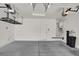 Spacious garage featuring shelving, water tank, and water filtration system at 7814 Granite City Ct, Las Vegas, NV 89166