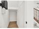 This hallway includes a staircase, laminate floors and neutral walls at 7814 Granite City Ct, Las Vegas, NV 89166