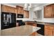 The kitchen features stainless steel appliances, an island, and lots of cabinet space at 7814 Granite City Ct, Las Vegas, NV 89166