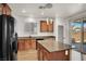 This kitchen offers an island, stainless steel appliances, and granite countertops at 7814 Granite City Ct, Las Vegas, NV 89166