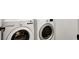 Close-up of modern white LG washer and dryer units in the laundry area at 7814 Granite City Ct, Las Vegas, NV 89166