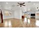 Open concept living room featuring wood floors, recessed lighting, a ceiling fan, and backyard access at 7814 Granite City Ct, Las Vegas, NV 89166