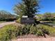 Elegant entrance to The Promenade featuring lush greenery and attractive landscaping at 7814 Granite City Ct, Las Vegas, NV 89166