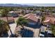 Aerial view of a charming desert home with a large driveway and a beautifully landscaped yard at 800 Antonio Dr, Las Vegas, NV 89107