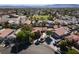 Expansive aerial view showing the desert home's location near a baseball field and wide streets at 800 Antonio Dr, Las Vegas, NV 89107