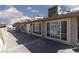 Exterior view of home's backyard showcasing a concrete patio and large windows at 800 Antonio Dr, Las Vegas, NV 89107