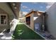 Side yard featuring a storage shed and artificial turf area, ideal for recreation at 800 Antonio Dr, Las Vegas, NV 89107
