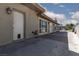 Exterior view of home's backyard showcasing a concrete patio and access door at 800 Antonio Dr, Las Vegas, NV 89107