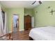 Spacious bedroom featuring wood floors, a walk-in closet, and a decorative wooden armoire at 800 Antonio Dr, Las Vegas, NV 89107