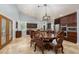 Elegant dining area connected to the kitchen with an ornate table and kitchen views at 800 Antonio Dr, Las Vegas, NV 89107