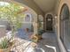 Inviting front entrance with a covered porch and decorative plants and exterior lighting at 800 Antonio Dr, Las Vegas, NV 89107