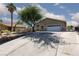 Exterior view of a well-maintained house featuring a large front yard with desert landscaping at 800 Antonio Dr, Las Vegas, NV 89107