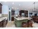 Stylish kitchen with a granite island, seating, and updated stainless steel appliances at 800 Antonio Dr, Las Vegas, NV 89107
