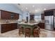 Gourmet kitchen featuring an island with seating, stainless steel appliances, and custom cabinetry at 800 Antonio Dr, Las Vegas, NV 89107