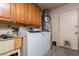 Functional laundry area with a modern washer/dryer and ample storage cabinets at 800 Antonio Dr, Las Vegas, NV 89107