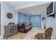 Cozy den with a comfortable sofa, tiled floor, and a mounted television on the wall at 800 Antonio Dr, Las Vegas, NV 89107