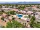 Residential home featuring solar panels, desert landscaping, and a private backyard pool with mountain views at 8032 Audubon Canyon St, Las Vegas, NV 89131