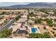 Residential area featuring a home with desert landscaping, a private pool, and mountain views at 8032 Audubon Canyon St, Las Vegas, NV 89131
