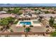 Spacious backyard with a private pool, patio area, and desert landscaping for relaxing outdoor living at 8032 Audubon Canyon St, Las Vegas, NV 89131