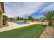 Lush backyard with a sparkling pool, spa, mature landscaping, and gravel ground cover at 8032 Audubon Canyon St, Las Vegas, NV 89131