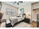 Bedroom featuring neutral colors, a TV, and bright windows at 8032 Audubon Canyon St, Las Vegas, NV 89131