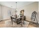Well-lit dining room featuring a decorative chandelier and neutral tones throughout at 8032 Audubon Canyon St, Las Vegas, NV 89131