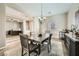 Cozy dining room with wood-look flooring and easy access to the office space at 8032 Audubon Canyon St, Las Vegas, NV 89131