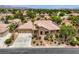 Charming single-Gathering home with a well-manicured front yard and mature desert landscaping at 8032 Audubon Canyon St, Las Vegas, NV 89131