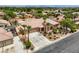 Well-maintained home featuring mature palm trees, a three-car garage, and meticulous landscaping at 8032 Audubon Canyon St, Las Vegas, NV 89131