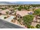 Lovely home with a tile roof, three-car garage, and desert landscaping in a tranquil neighborhood at 8032 Audubon Canyon St, Las Vegas, NV 89131