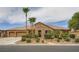 Charming single-story home featuring a stone facade, three-car garage, and well-manicured landscaping at 8032 Audubon Canyon St, Las Vegas, NV 89131