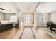 Elegant foyer featuring tile flooring, a double door entrance, and open access to office space at 8032 Audubon Canyon St, Las Vegas, NV 89131