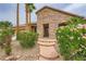 Inviting front entrance with stone accents, mature bushes, and well-maintained landscaping at 8032 Audubon Canyon St, Las Vegas, NV 89131