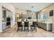 Bright kitchen with gray cabinets, stainless appliances, and a large island with seating at 8032 Audubon Canyon St, Las Vegas, NV 89131