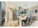 Bright kitchen with stainless steel appliances and marble countertops on the center island at 8032 Audubon Canyon St, Las Vegas, NV 89131