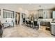 Spacious kitchen features gray cabinets, an island with seating, and a built-in desk area at 8032 Audubon Canyon St, Las Vegas, NV 89131
