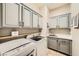 Laundry room with cabinets, washer, and sink at 8032 Audubon Canyon St, Las Vegas, NV 89131