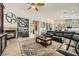 Open living room with custom built-ins, wet bar and seamless flow to the kitchen area at 8032 Audubon Canyon St, Las Vegas, NV 89131