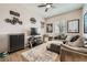 Cozy living room with comfortable seating, TV, and movie-themed decor at 8032 Audubon Canyon St, Las Vegas, NV 89131