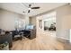 Spacious office with wood floors, ceiling fan, and an open doorway to dining area at 8032 Audubon Canyon St, Las Vegas, NV 89131