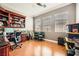 Office room with built in shelves, and hardwood floor at 8032 Audubon Canyon St, Las Vegas, NV 89131